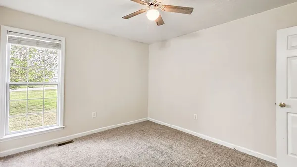 an empty room with a bathroom