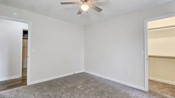 a bathroom with a double vanity sink toilet and a mirror