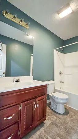 a bathroom with a sink and toilet