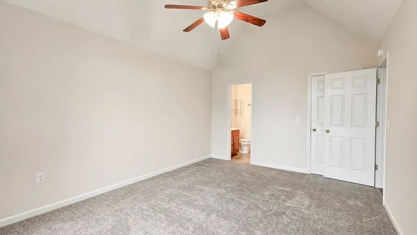 an empty room with closet area