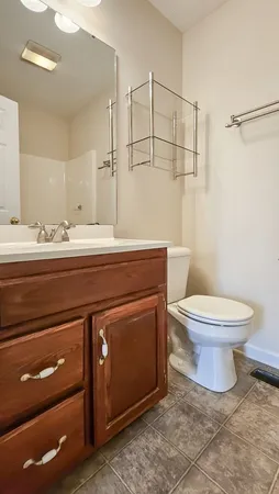 a bathroom with a bath tub with a shower