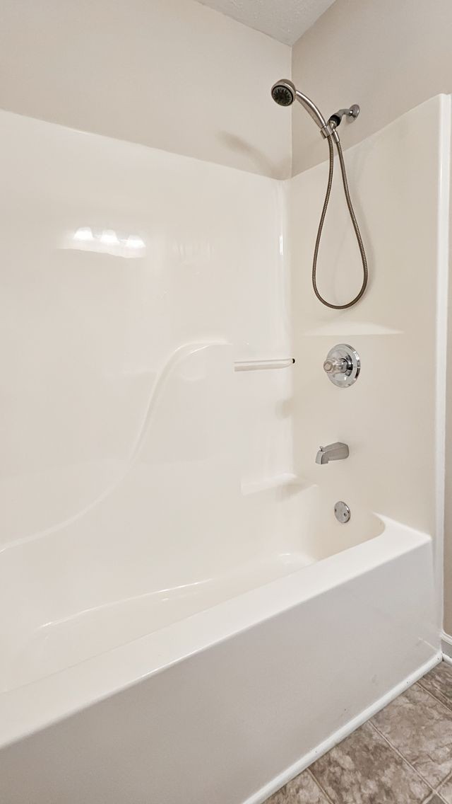 11 Amberwood Road Fayetteville, TN 37334 - Photo 31 of 36 a bathroom with a bath tub with a shower