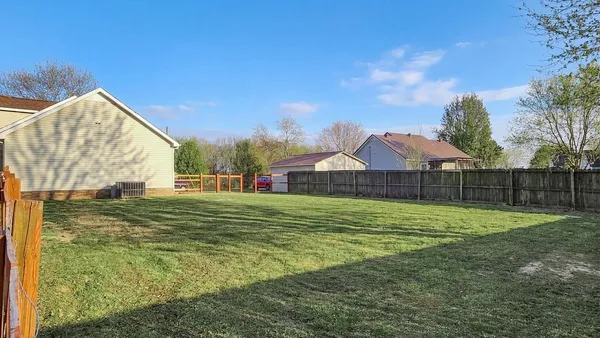 a view of a house with a big yard