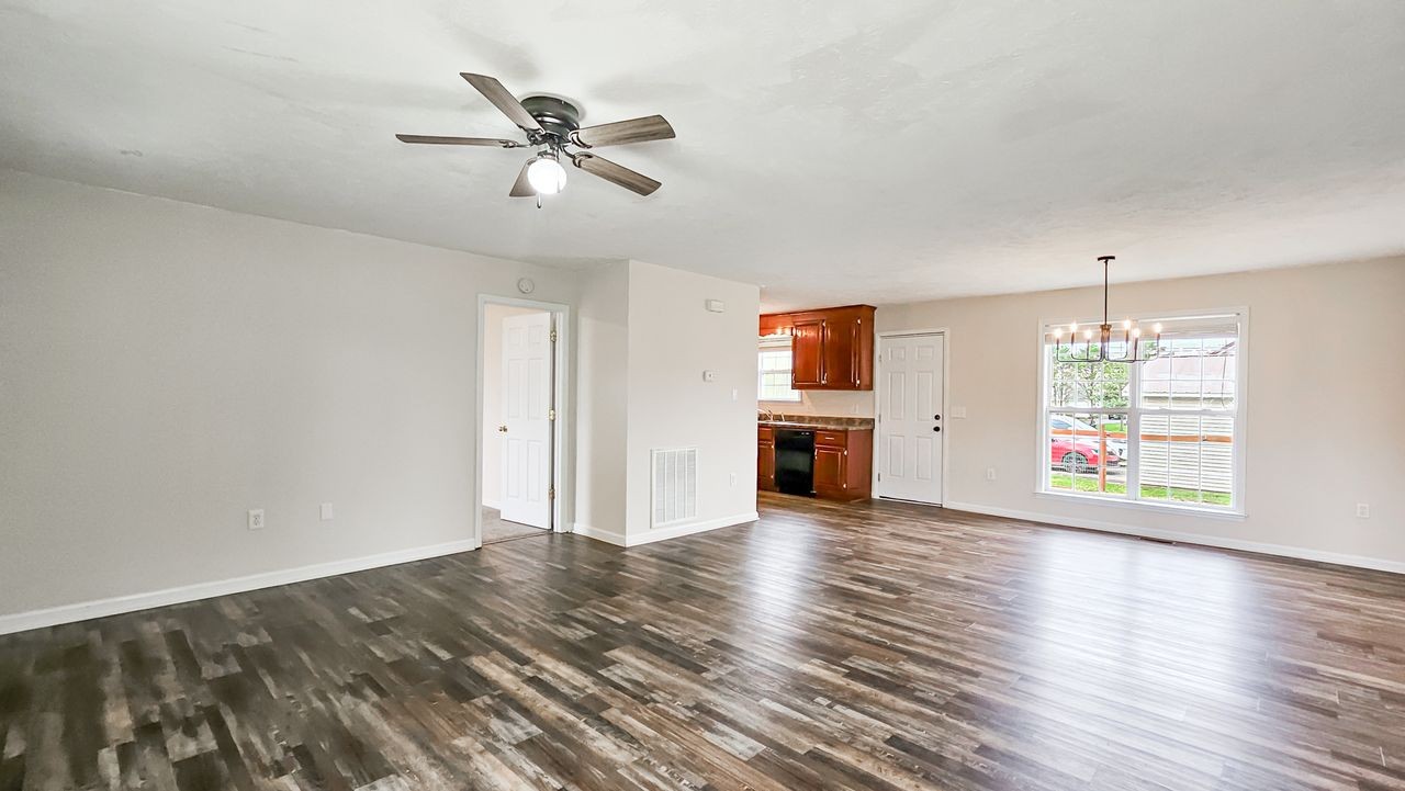 11 Amberwood Road Fayetteville, TN 37334 - Photo 5 of 36 a view of an empty room with a window and wooden floor