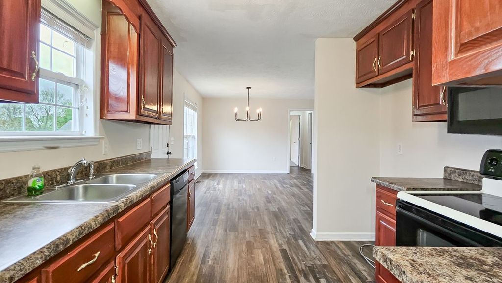 11 Amberwood Road Fayetteville, TN 37334 - Photo 6 of 36 a kitchen that has a sink a stove and wooden floor