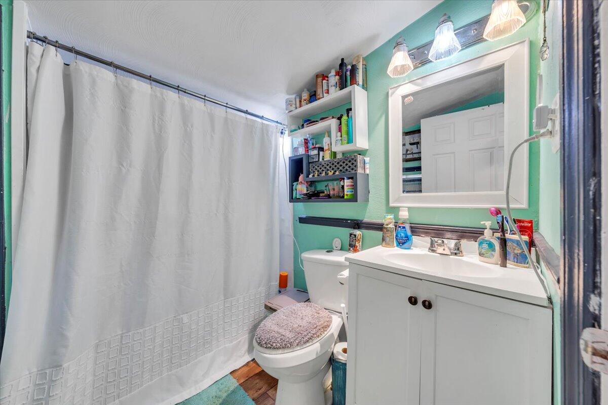 1319 Liberty Road Northeast Roanoke, VA 24012 - Photo 16 of 36 a bathroom with a sink toilet and shower