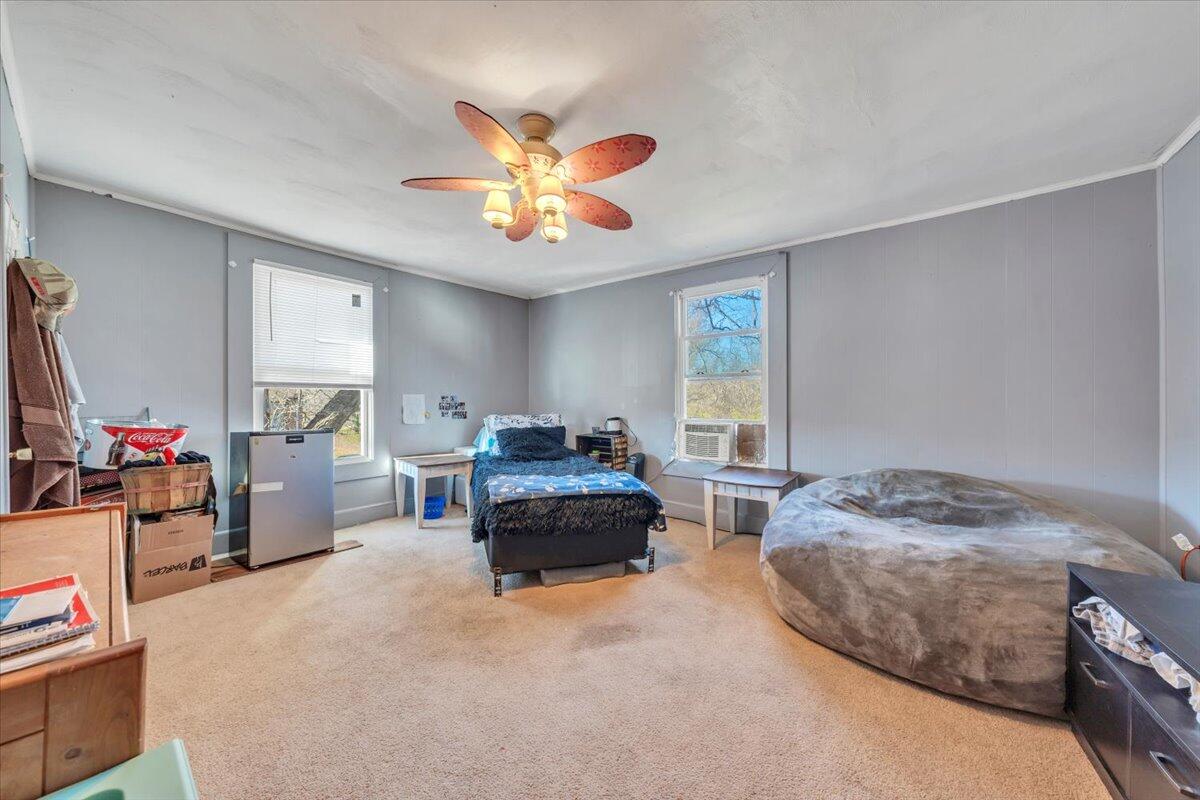 1319 Liberty Road Northeast Roanoke, VA 24012 - Photo 20 of 36 a living room with furniture and a chandelier