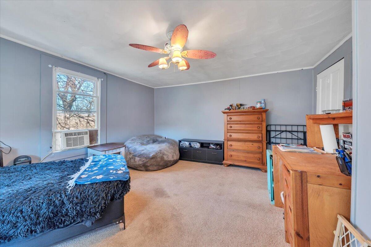 1319 Liberty Road Northeast Roanoke, VA 24012 - Photo 21 of 36 a bedroom with a bed and a chandelier