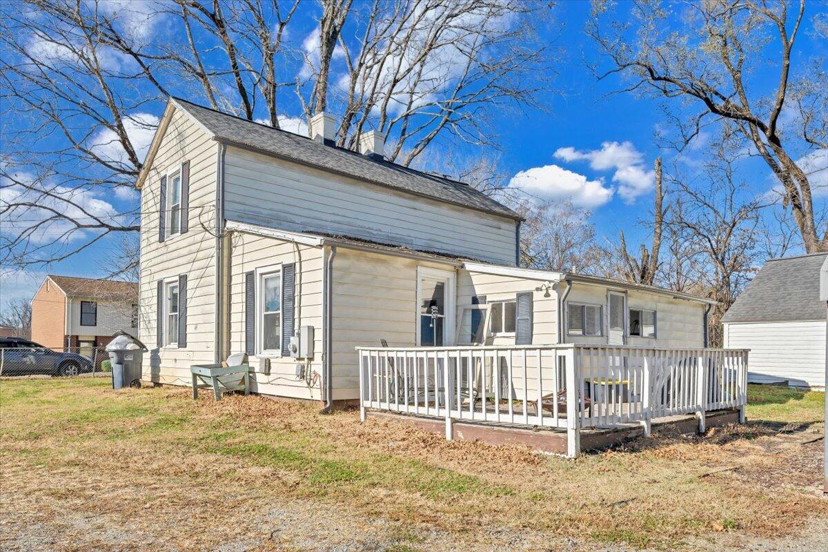 1319 Liberty Road Northeast Roanoke, VA 24012 - Photo 26 of 36 a view of a house with a small yard and wooden fence