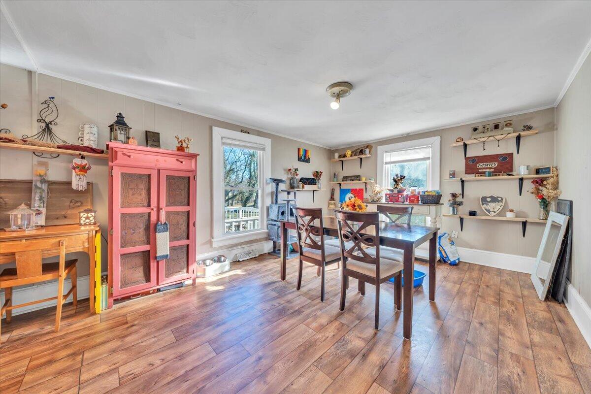 1319 Liberty Road Northeast Roanoke, VA 24012 - Photo 6 of 36 a view of a dining room with furniture and wooden floor