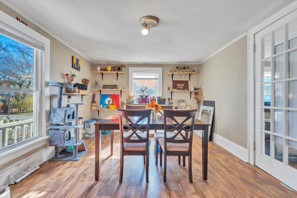 1319 Liberty Road Northeast Roanoke, VA 24012 - Photo 7 of 36 a view of a dining room with furniture and wooden floor