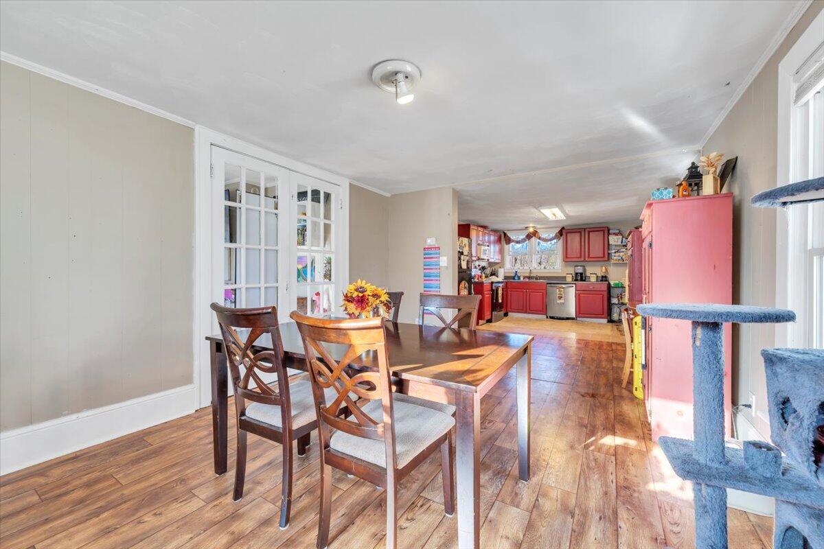 1319 Liberty Road Northeast Roanoke, VA 24012 - Photo 9 of 36 a view of a dining room with furniture and wooden floor