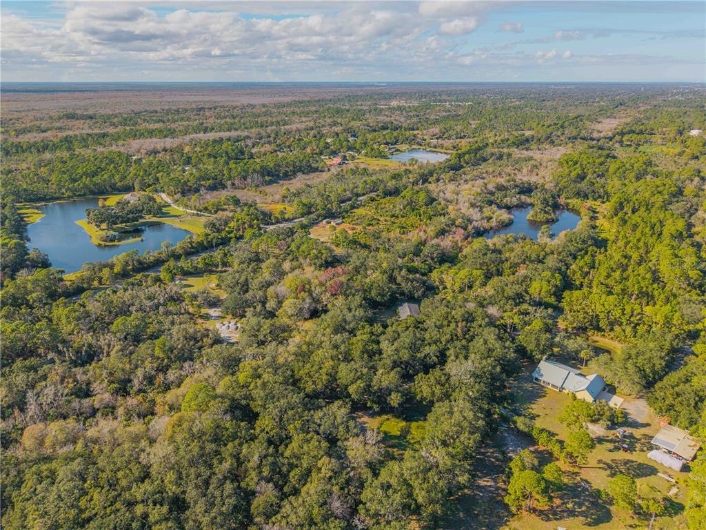 480 Clinton Cemetery Road Edgewater, FL 32141 - Photo 18 of 29 a view of a city with an ocean beach