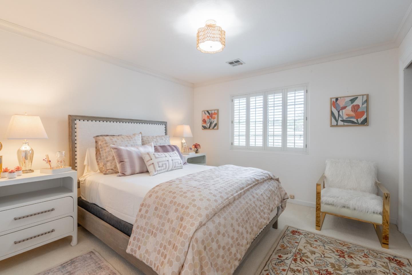 1043 Broncho Road Pebble Beach, CA 93953 - Photo 18 of 21 a bedroom with a bed and a lamp