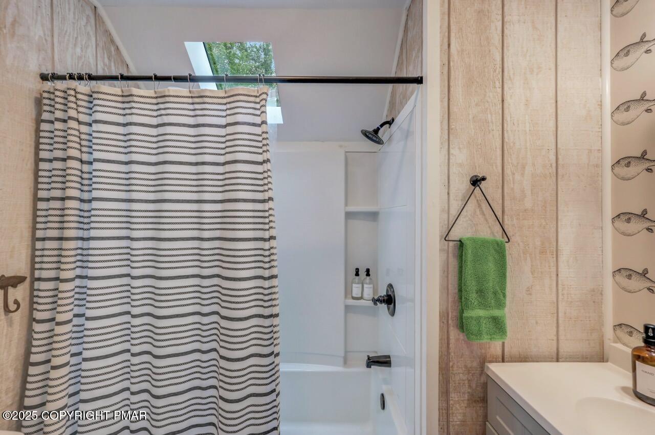1169 Deer Trail Road Pocono Pines, PA 18350 - Photo 14 of 21 a bathroom with a sink and a bathtub