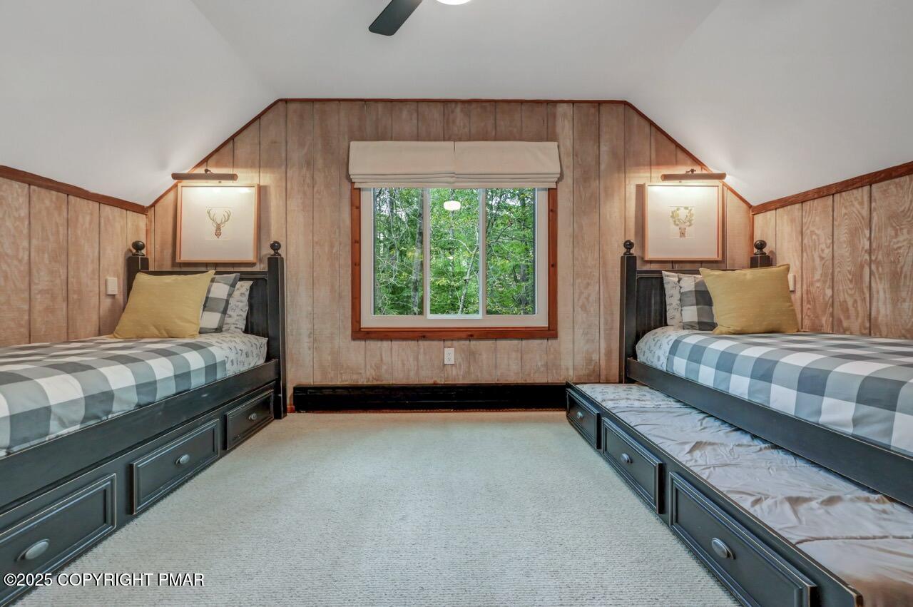 1169 Deer Trail Road Pocono Pines, PA 18350 - Photo 15 of 21 a bedroom with a bed a lamp and window
