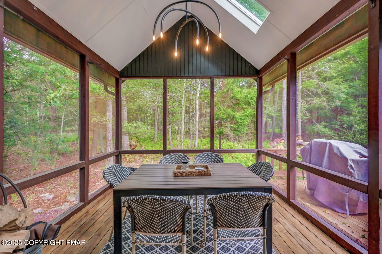 1169 Deer Trail Road Pocono Pines, PA 18350 - Photo 16 of 21 a view of a dining room with furniture window and outside view