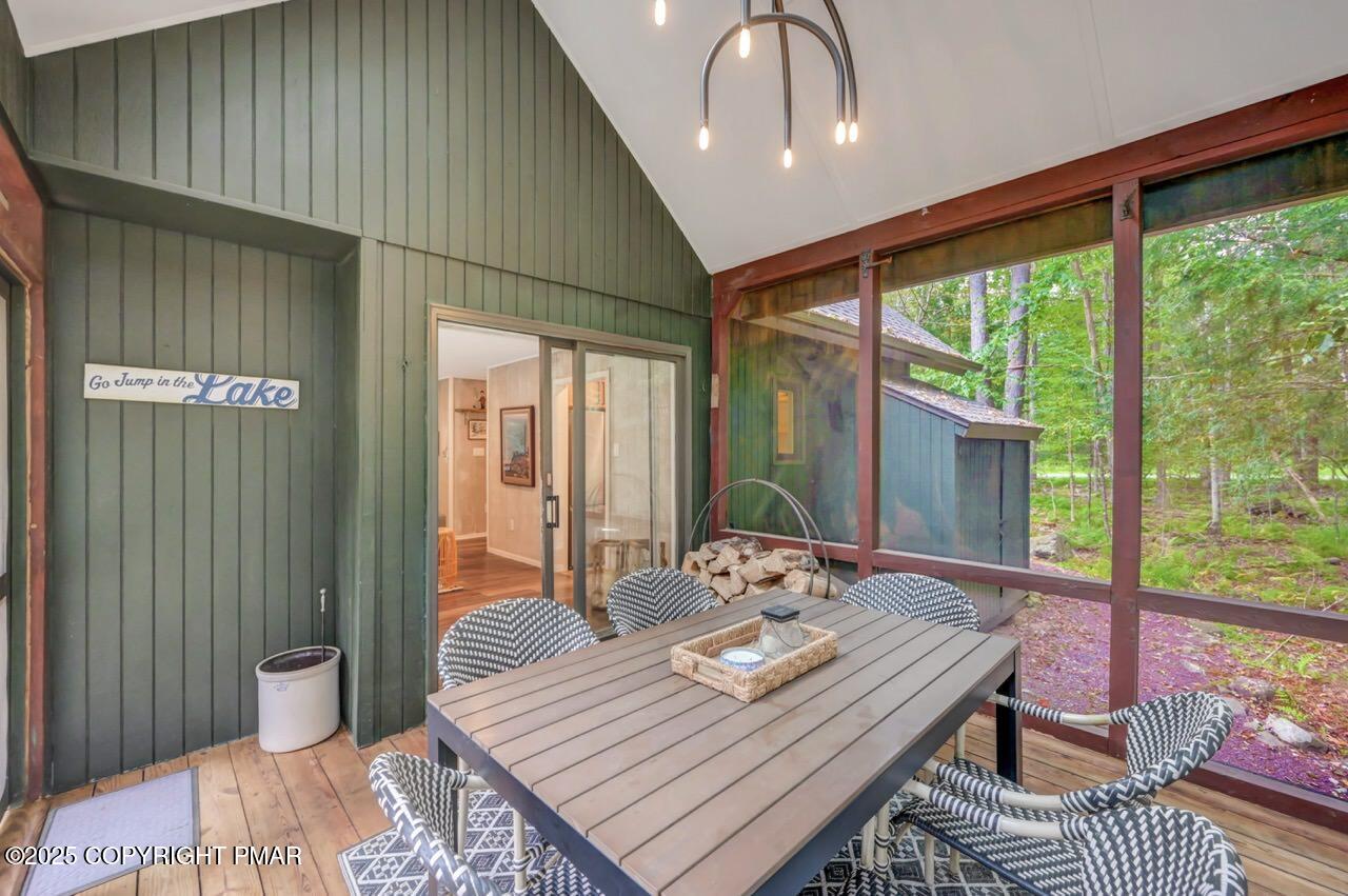 1169 Deer Trail Road Pocono Pines, PA 18350 - Photo 17 of 21 a view of a dining room with furniture window and wooden floor
