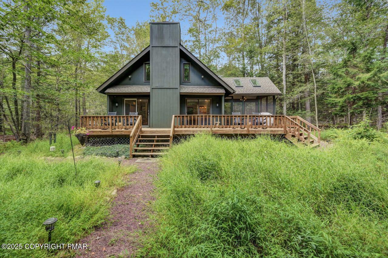1169 Deer Trail Road Pocono Pines, PA 18350 - Photo 18 of 21 a front view of a house with a yard