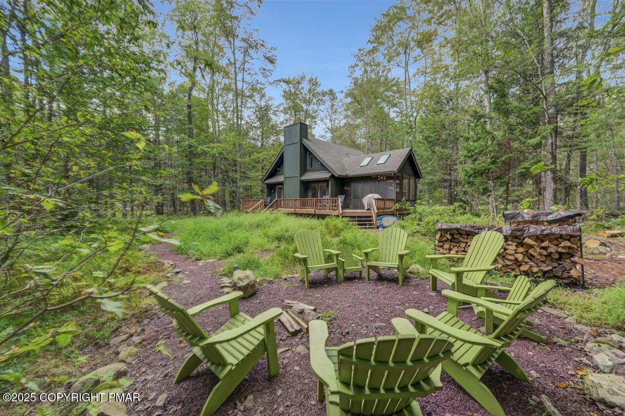 1169 Deer Trail Road Pocono Pines, PA 18350 - Photo 19 of 21 a view of an chairs and table in the garden