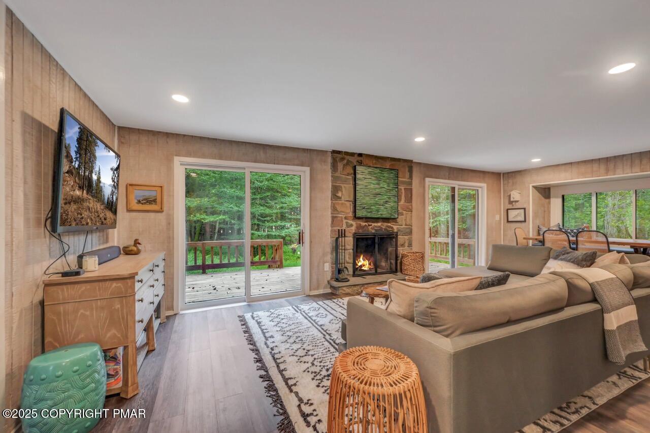 1169 Deer Trail Road Pocono Pines, PA 18350 - Photo 4 of 21 a living room with furniture and a floor to ceiling window
