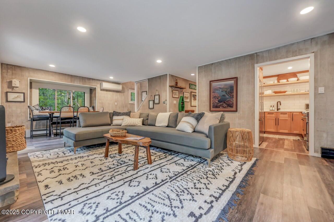 1169 Deer Trail Road Pocono Pines, PA 18350 - Photo 5 of 21 a living room with furniture and a wooden floor