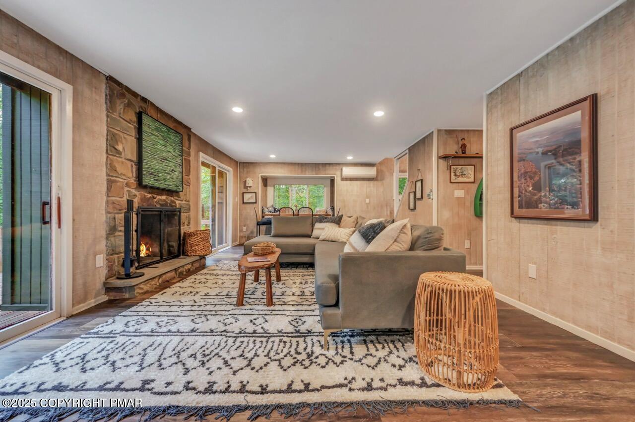 1169 Deer Trail Road Pocono Pines, PA 18350 - Photo 6 of 21 a living room with furniture and a fireplace