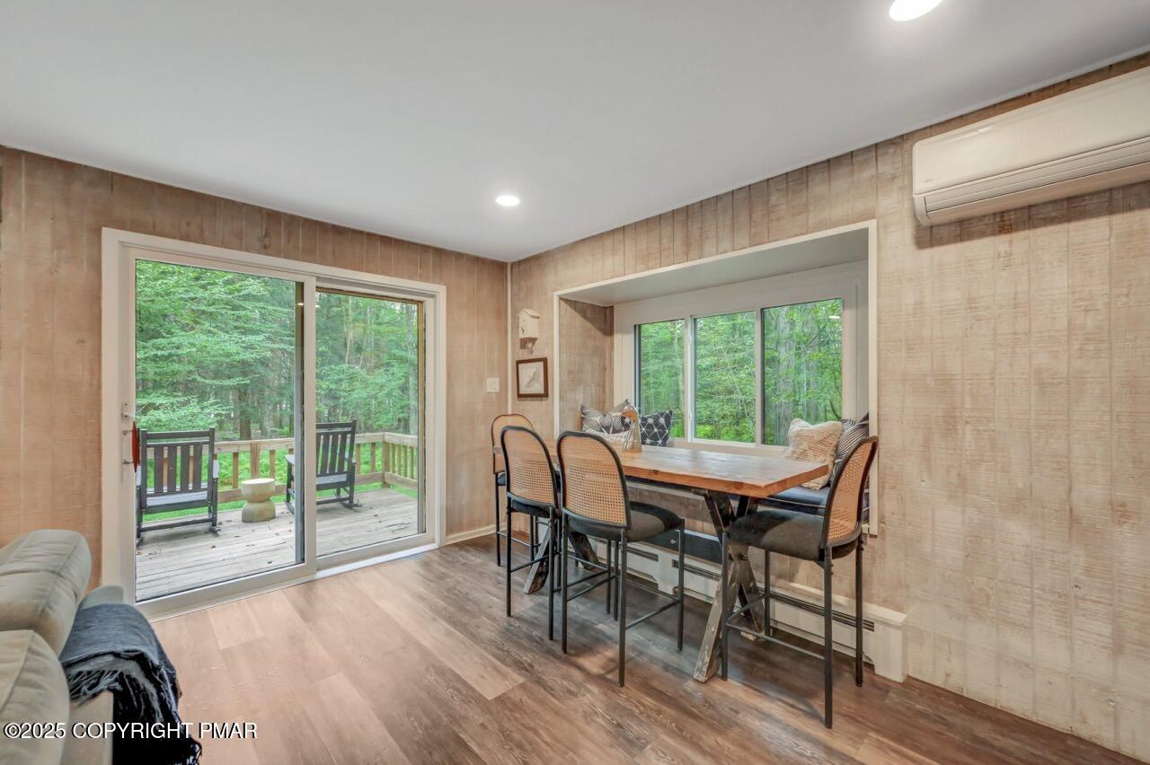 1169 Deer Trail Road Pocono Pines, PA 18350 - Photo 7 of 21 a dining room with furniture and wooden floor