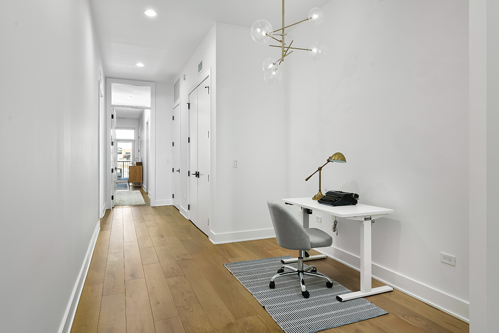 1132 West Adams Street, Unit 5W Chicago, IL 60607 - Photo 11 of 26 a view of a workspace with furniture and wooden floor