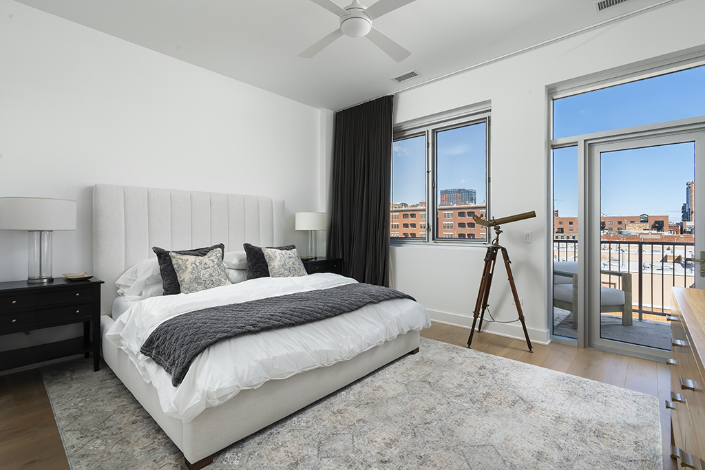 1132 West Adams Street, Unit 5W Chicago, IL 60607 - Photo 16 of 26 a bedroom with a bed and a flat screen tv