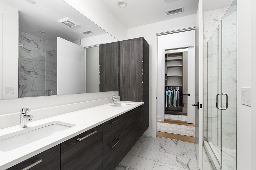 1132 West Adams Street, Unit 5W Chicago, IL 60607 - Photo 20 of 26 a bathroom with a double vanity sink and mirror