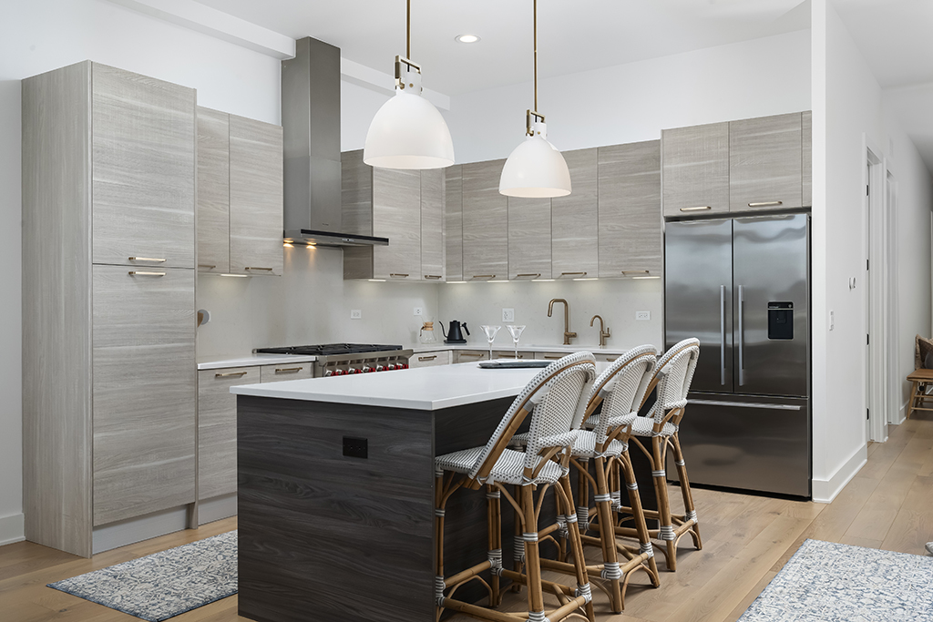 1132 West Adams Street, Unit 5W Chicago, IL 60607 - Photo 3 of 26 a kitchen with a sink a stove and chairs