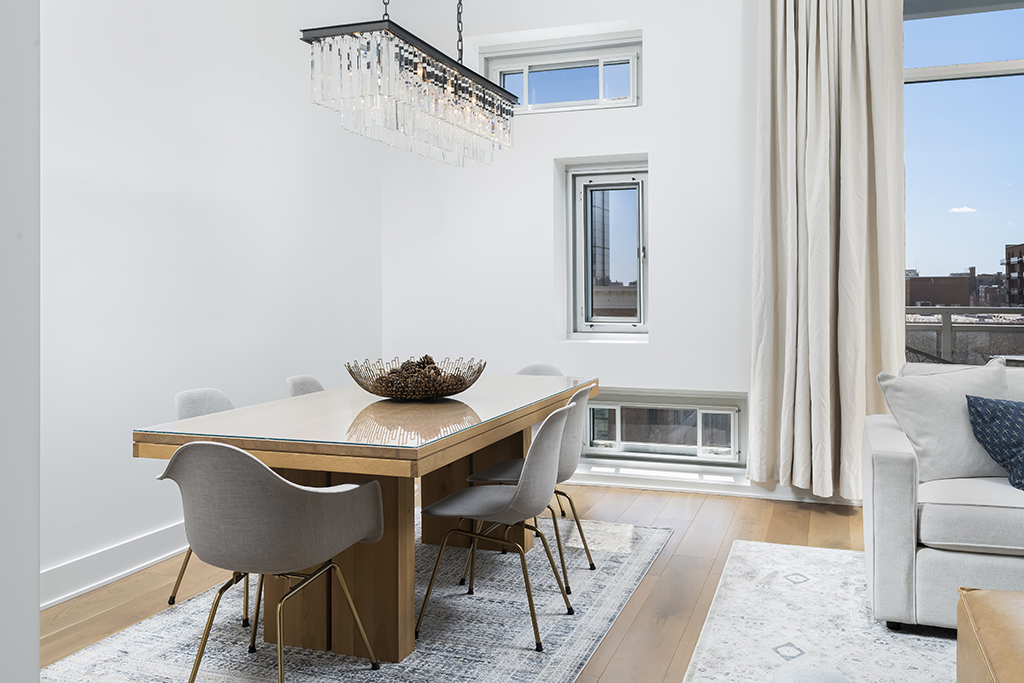 1132 West Adams Street, Unit 5W Chicago, IL 60607 - Photo 5 of 26 a view of a dining room with furniture and wooden floor