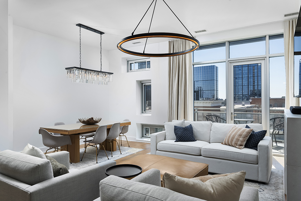 1132 West Adams Street, Unit 5W Chicago, IL 60607 - Photo 6 of 26 a living room with furniture a ceiling fan and a window