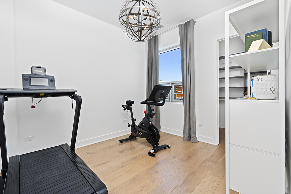 1132 West Adams Street, Unit 5W Chicago, IL 60607 - Photo 8 of 26 a view of a room with gym equipment