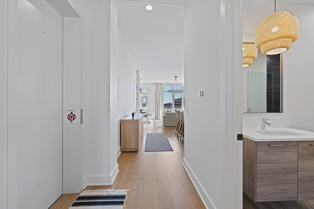 1132 West Adams Street, Unit 5W Chicago, IL 60607 - Photo 9 of 26 a view of a hallway with wooden floor and staircase