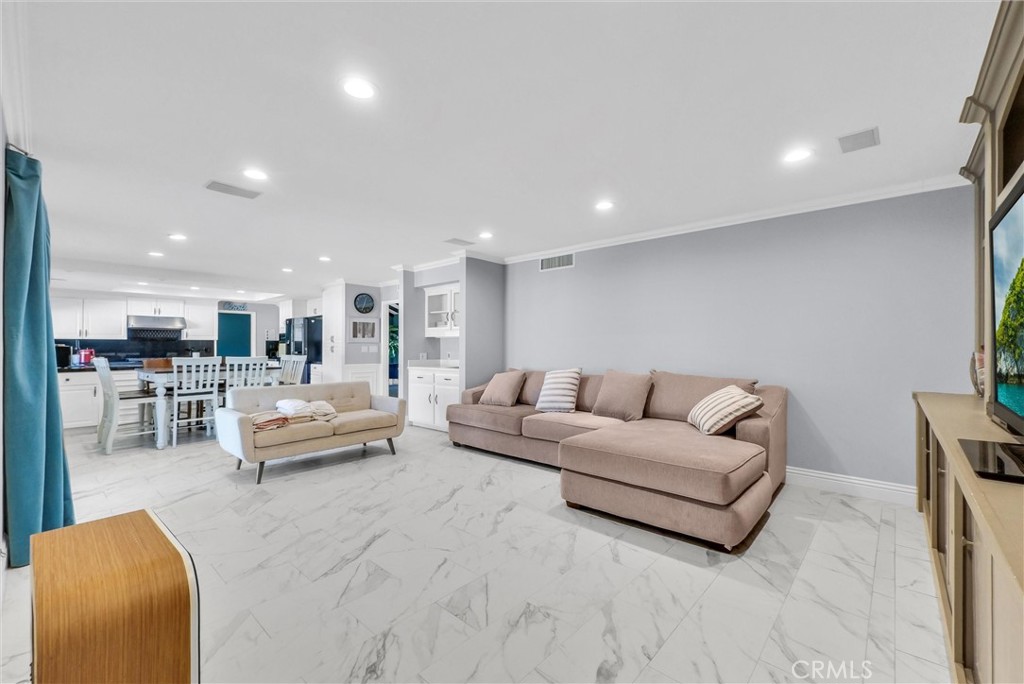1417 West James Way Anaheim, CA 92801 - Photo 11 of 40 a living room with furniture and view of kitchen