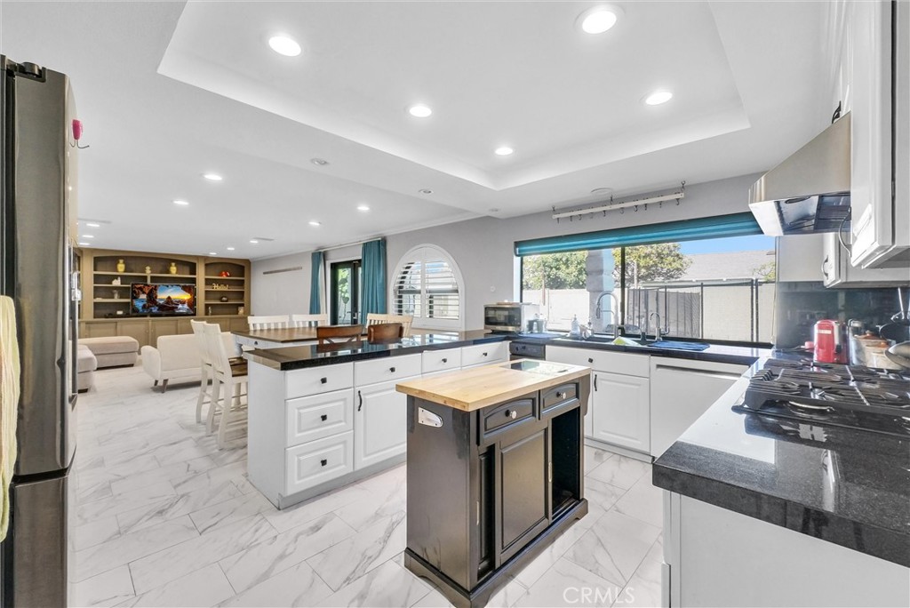 1417 West James Way Anaheim, CA 92801 - Photo 15 of 40 a kitchen with sink stove and cabinets