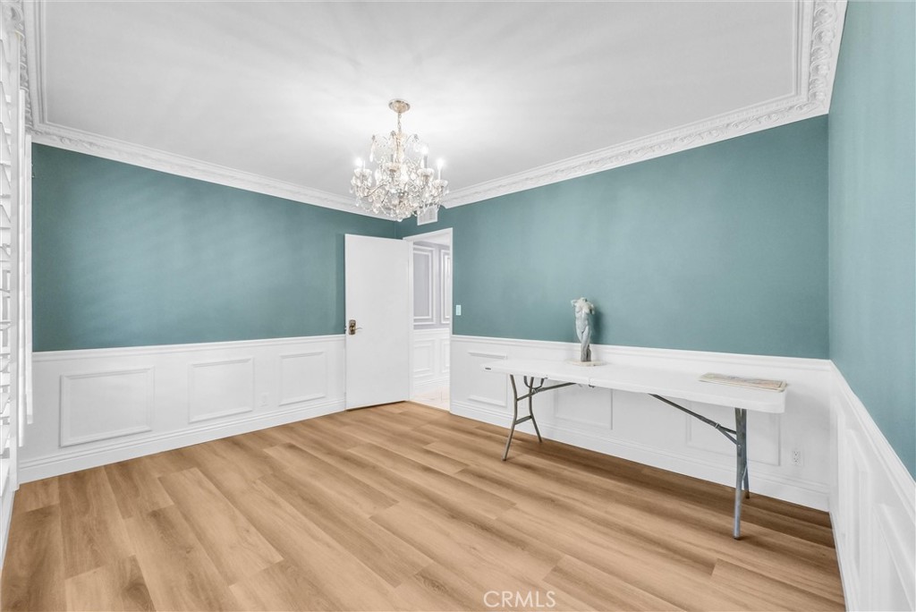 1417 West James Way Anaheim, CA 92801 - Photo 17 of 40 a view of a bedroom with a bed and chandelier