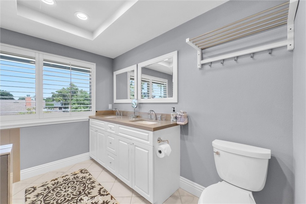 1417 West James Way Anaheim, CA 92801 - Photo 33 of 40 a bathroom with a toilet sink and mirror