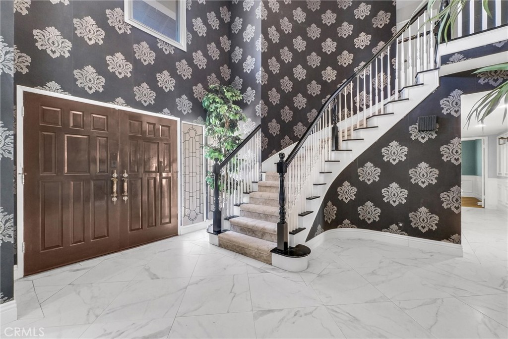 1417 West James Way Anaheim, CA 92801 - Photo 5 of 40 a view of entryway with stairs and wooden floor