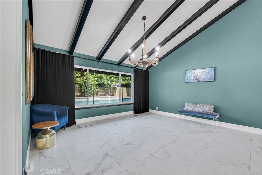 1417 West James Way Anaheim, CA 92801 - Photo 6 of 40 a room with a chair and a large window