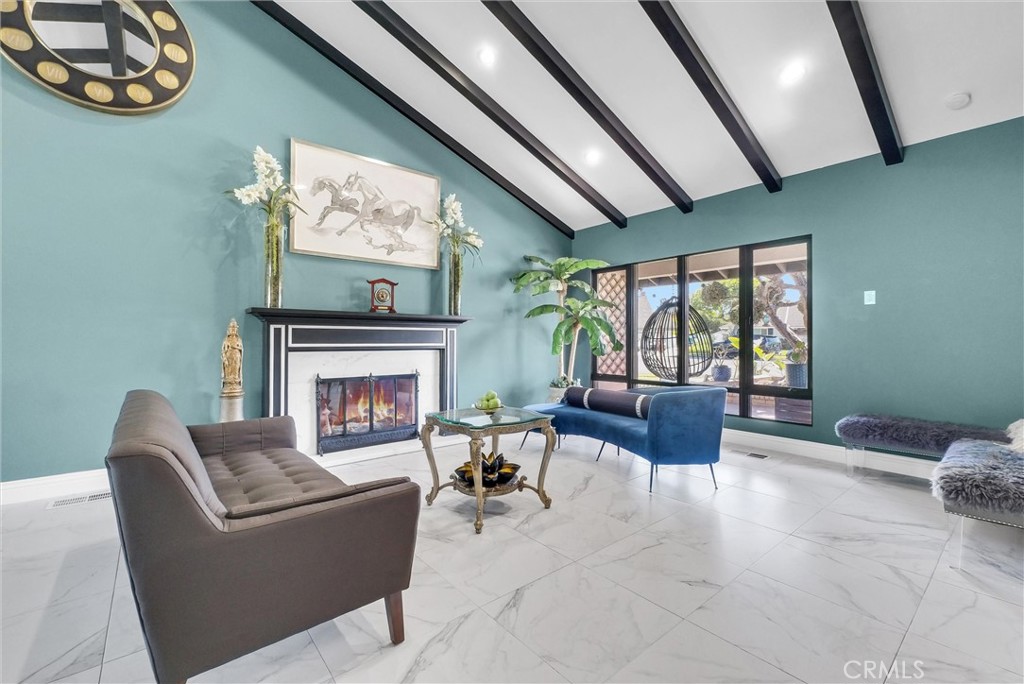 1417 West James Way Anaheim, CA 92801 - Photo 8 of 40 a living room with furniture and a fireplace