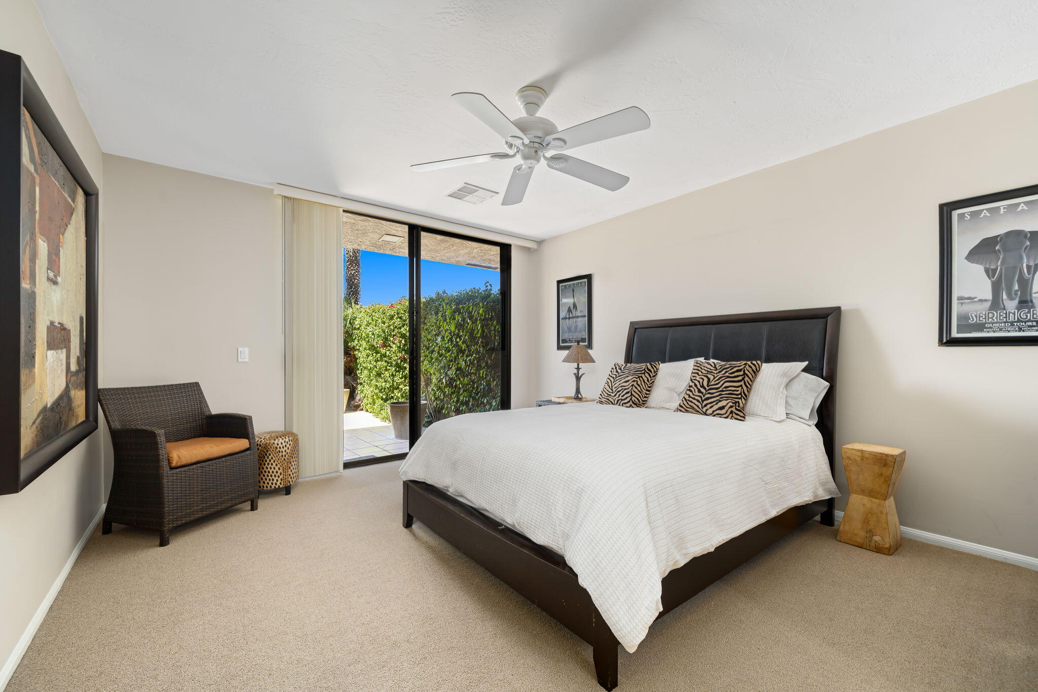 26 Stanford Drive Rancho Mirage, CA 92270 - Photo 25 of 39 a bedroom with a bed and a couch