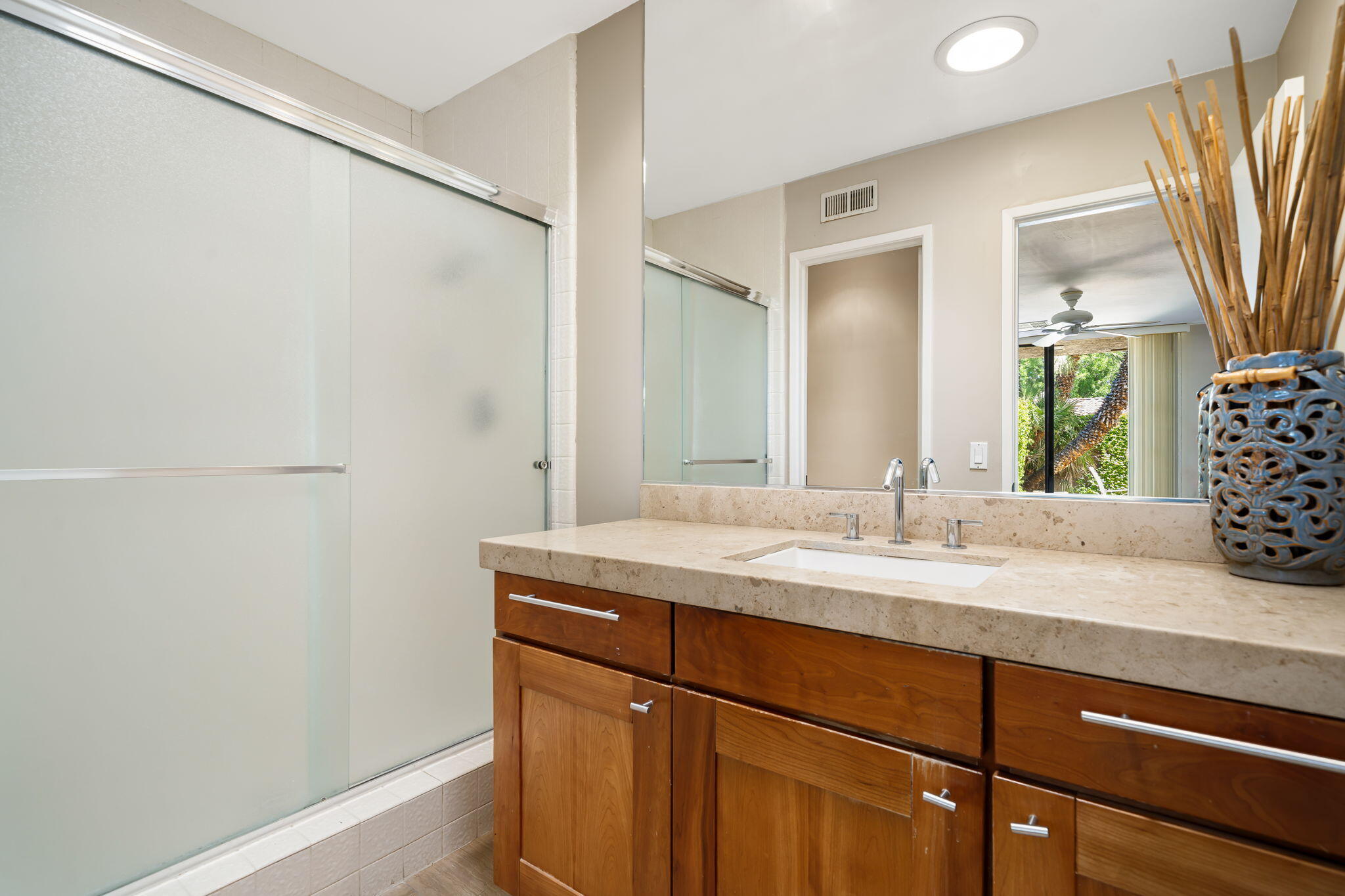 26 Stanford Drive Rancho Mirage, CA 92270 - Photo 26 of 39 a bathroom with a granite countertop sink and a mirror