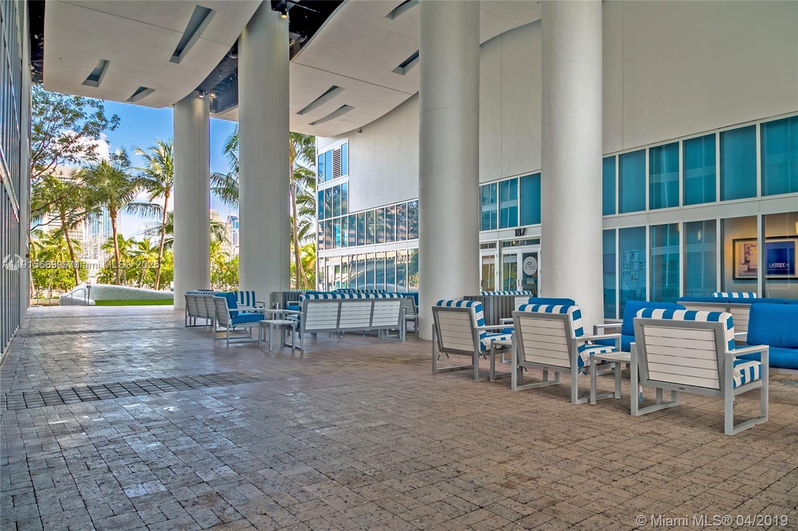 185 Southwest 7th Street, Unit 4212 Miami, FL 33130 - Photo 8 of 8 a view of living room with furniture and floor to ceiling windows