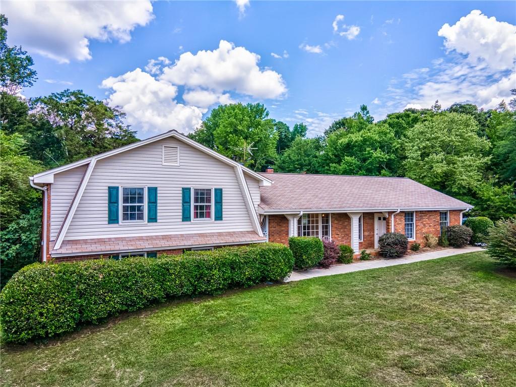 1604 Rucker Road Alpharetta, GA 30009 - Photo 1 of 1 a house that has a lot of plants in it