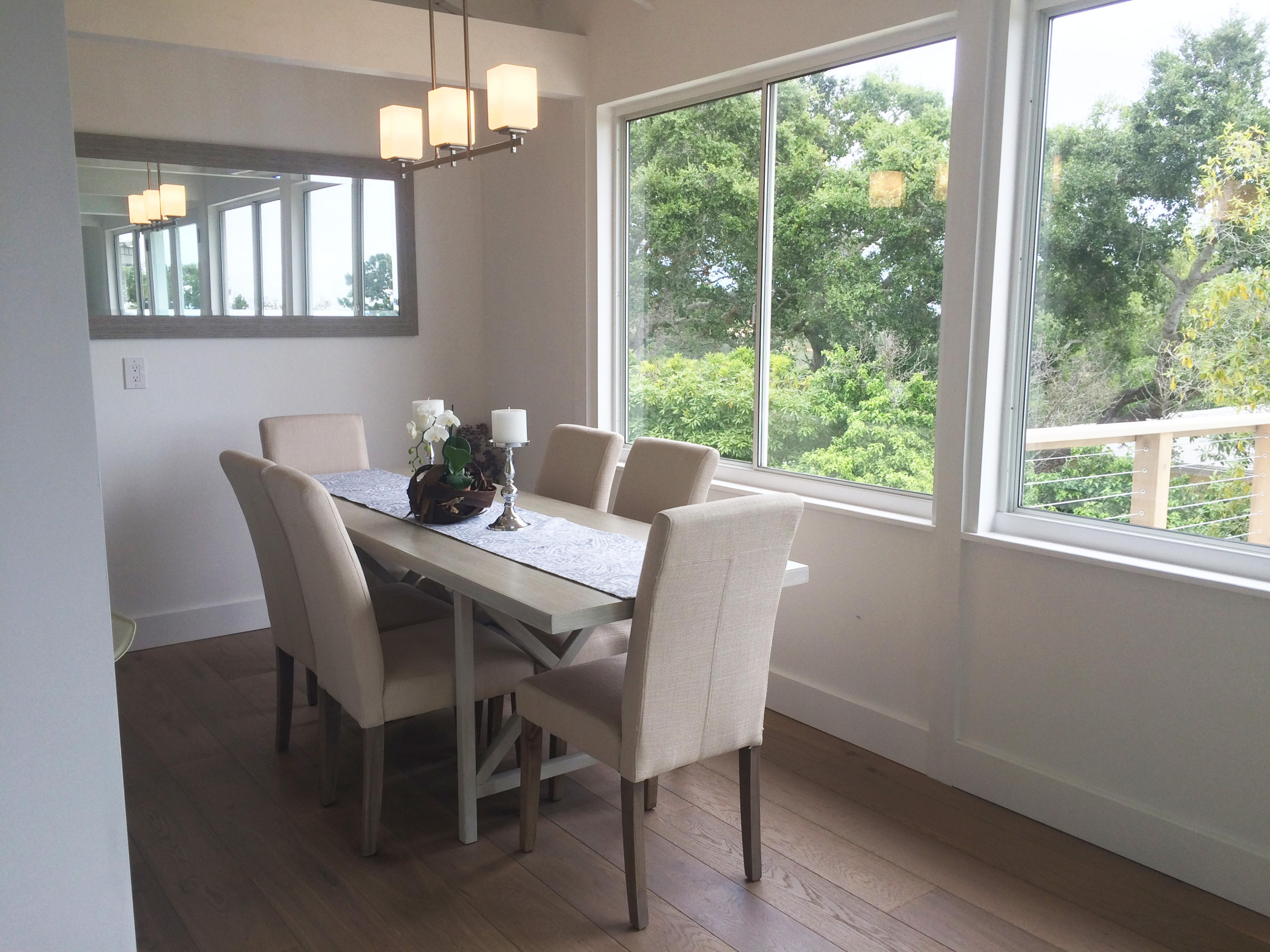 4 Fellowship Circle Santa Barbara, CA 93109 - Photo 12 of 27 a dining room with furniture a chandelier and wooden floor