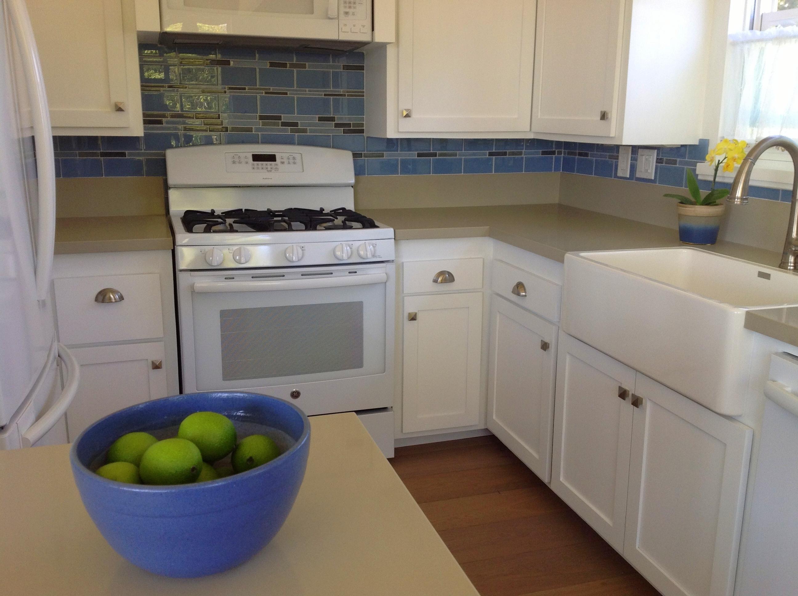 4 Fellowship Circle Santa Barbara, CA 93109 - Photo 14 of 27 a kitchen with a stove and white cabinets
