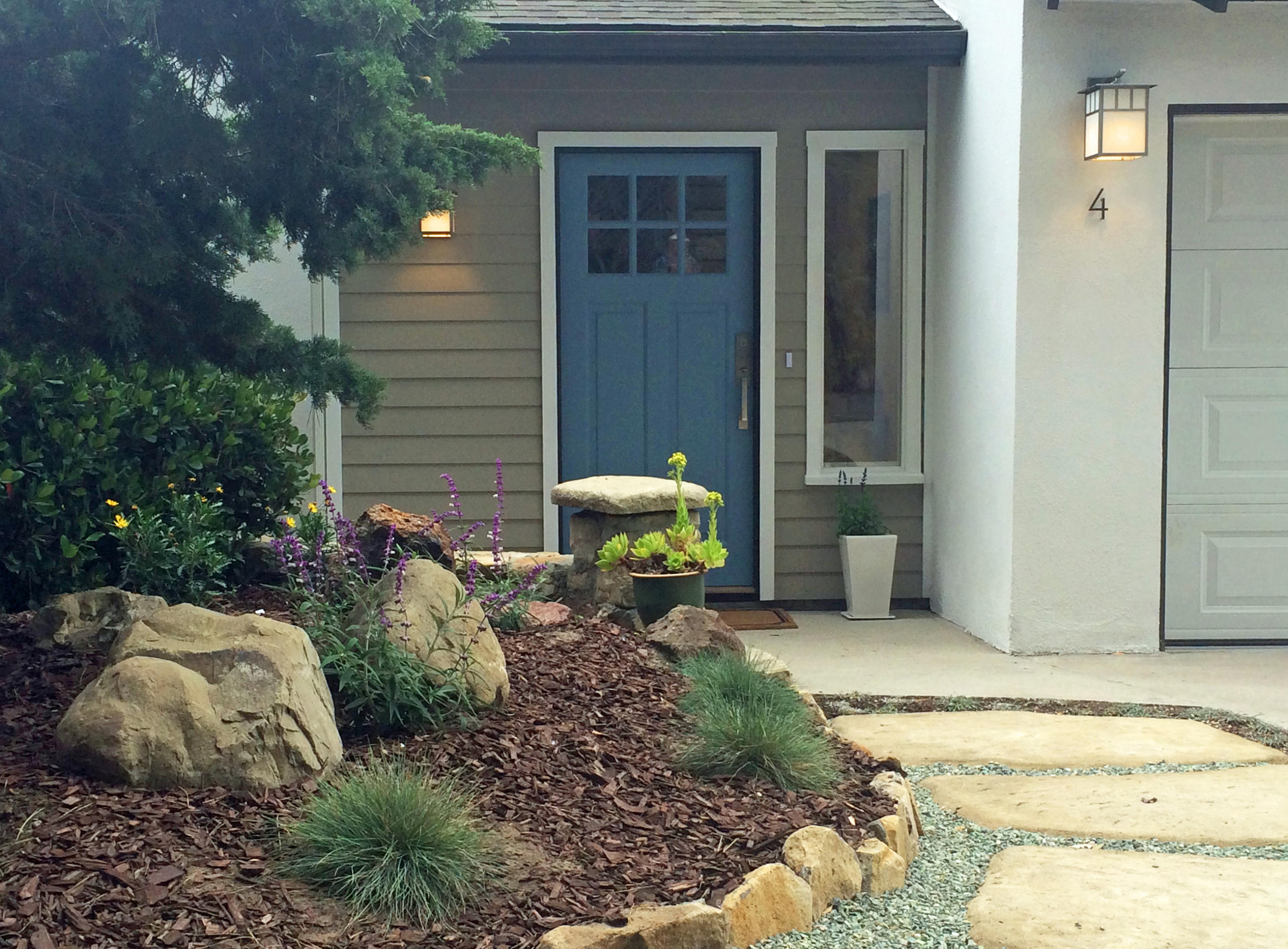4 Fellowship Circle Santa Barbara, CA 93109 - Photo 2 of 27 a backyard of a house with a yard and outdoor seating